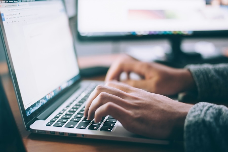 Person on Laptop Doing SaaS SEO